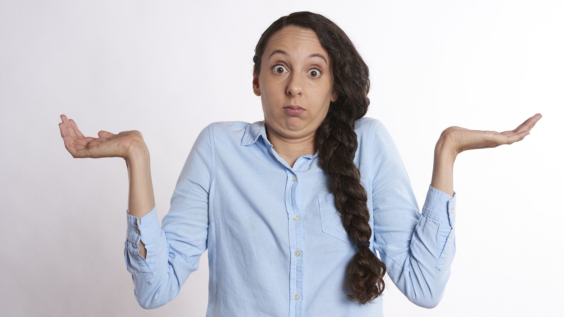 Woman shrugging as if confused